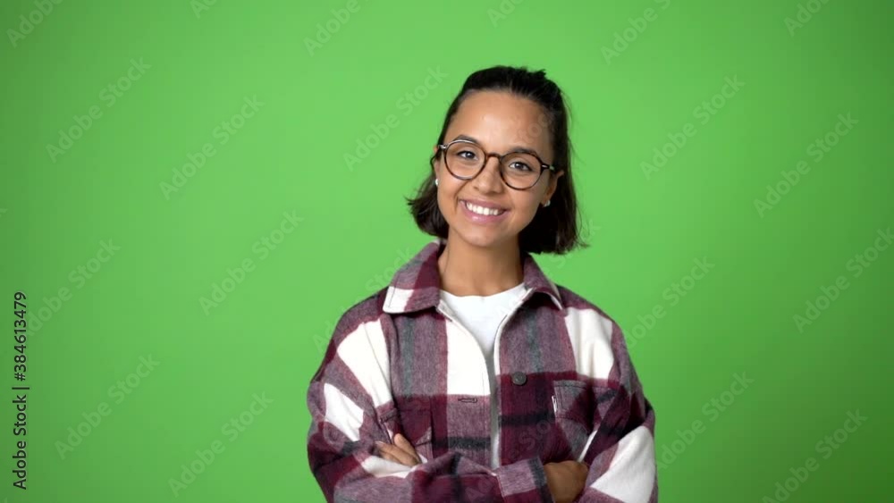 woman keeping the arms crossed in confident expression on green screen chroma key background woman keeping the arms crossed in confident expression on green screen chroma key background