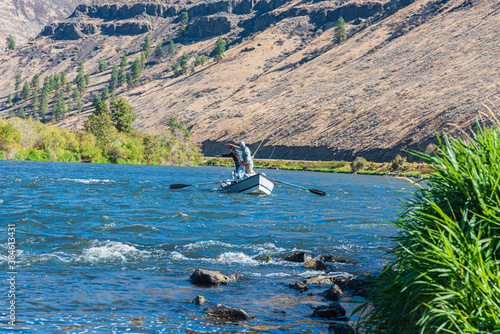 Landscape of Men Fly Fishing in a Drift Boat in the Yakima River Canyon