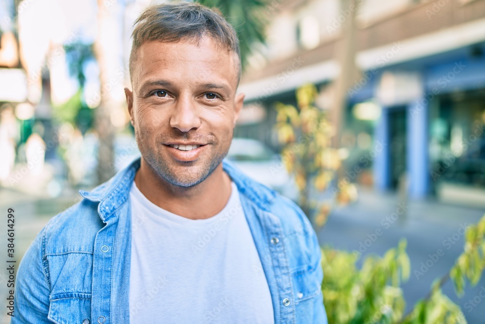 Young caucasian man smiling happy walking at the city. Young caucasian man smiling happy walking at the city.