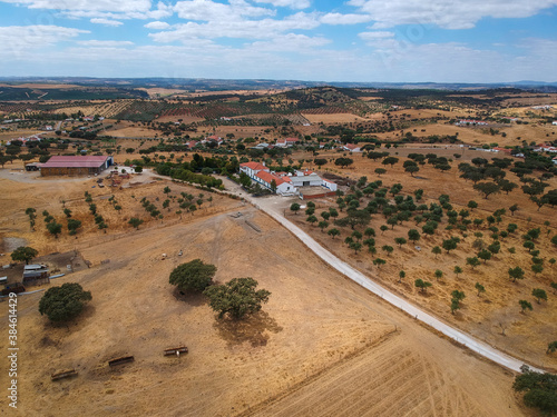 Aereal view from a farm with a barn in the countryside