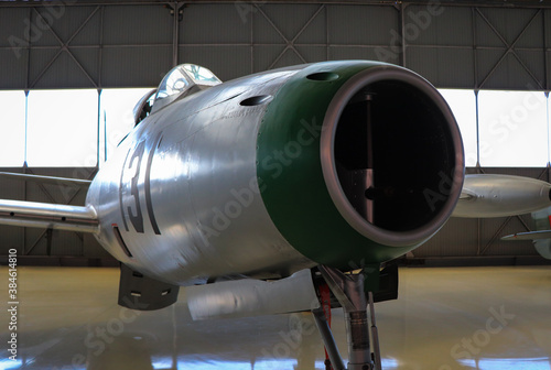 fighter jet airplane in a hangar