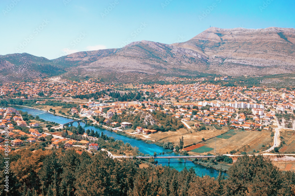 Bosnia and Herzegovina, Republika Srpska. View of Trebinje city and Trebisnjica river on sunny summer day. Color toning