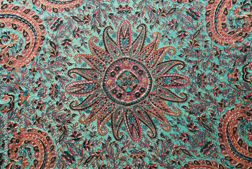 Bright traditional oriental pattern on a silk scarf.