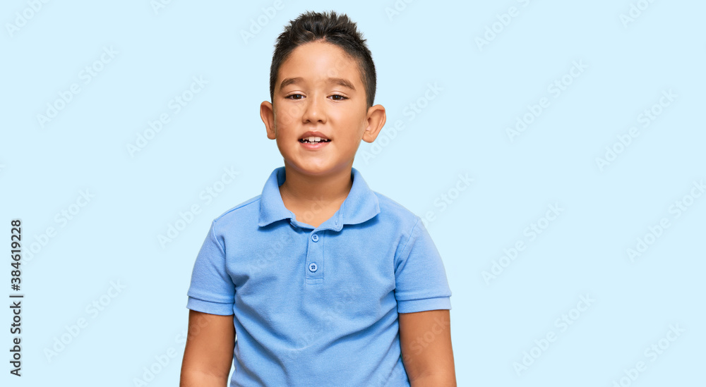 Little boy hispanic kid wearing casual clothes with a happy and cool smile on face. lucky person. Little boy hispanic kid wearing casual clothes with a happy and cool smile on face. lucky person.