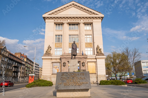 The building of Slovak National Museum (Slovenské národné múzeum) in Bratislava, front view, statue of Tomáš Garrigue Masaryk (T. G. Masaryk) on a sunny day