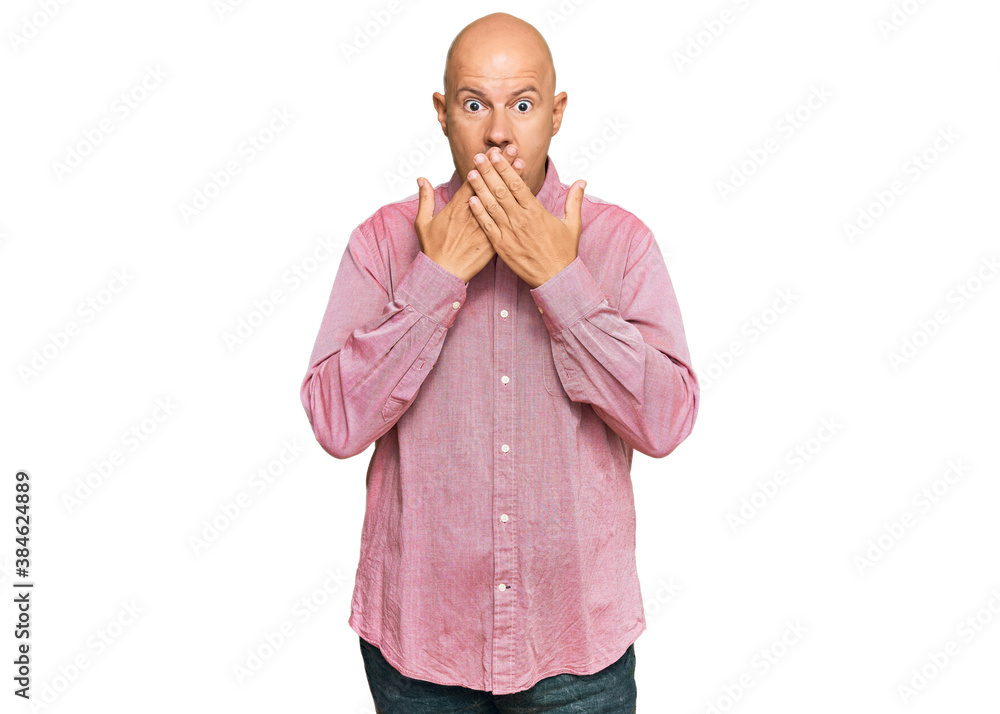 Middle age bald man wearing casual clothes shocked covering mouth with hands for mistake. secret concept. Middle age bald man wearing casual clothes shocked covering mouth with hands for mistake. secret concept.
