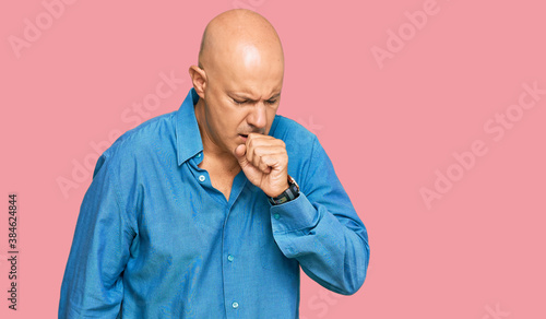 Middle age bald man wearing casual clothes feeling unwell and coughing as symptom for cold or bronchitis. health care concept. © Krakenimages.com