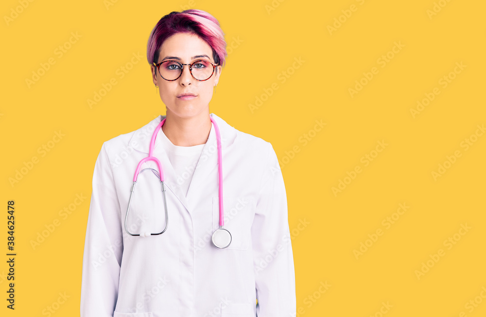 Young beautiful woman with pink hair wearing doctor uniform depressed and worry for distress, crying angry and afraid. sad expression. Young beautiful woman with pink hair wearing doctor uniform depressed and worry for distress, crying angry and afraid. sad expression.