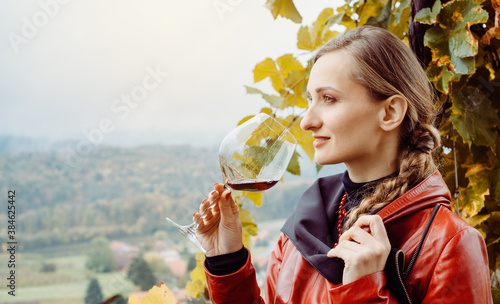 Woman having wine tasting in winery photo