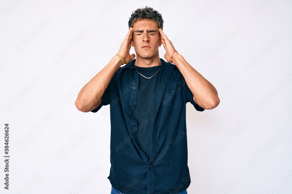 Fototapeta premium Young handsome man wearing casual clothes with hand on head, headache because stress. suffering migraine.
