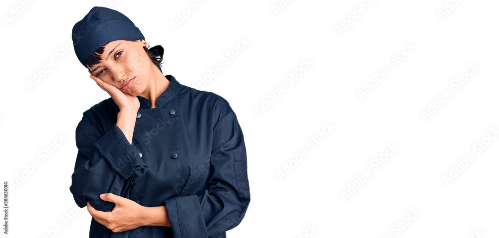 Young brunette woman with short hair wearing professional cook uniform thinking looking tired and bored with depression problems with crossed arms. Young brunette woman with short hair wearing professional cook uniform thinking looking tired and bored with depression problems with crossed arms.