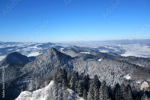 Panorama of winter mountains. Mountains and trees covered with snow