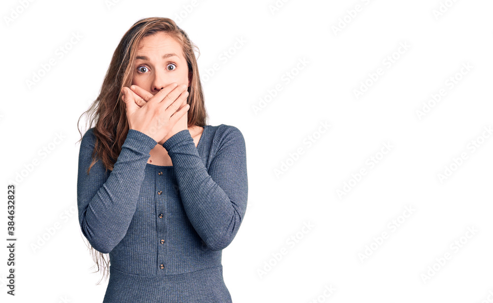 Young beautiful blonde woman wearing casual dress shocked covering mouth with hands for mistake. secret concept. Young beautiful blonde woman wearing casual dress shocked covering mouth with hands for mistake. secret concept.