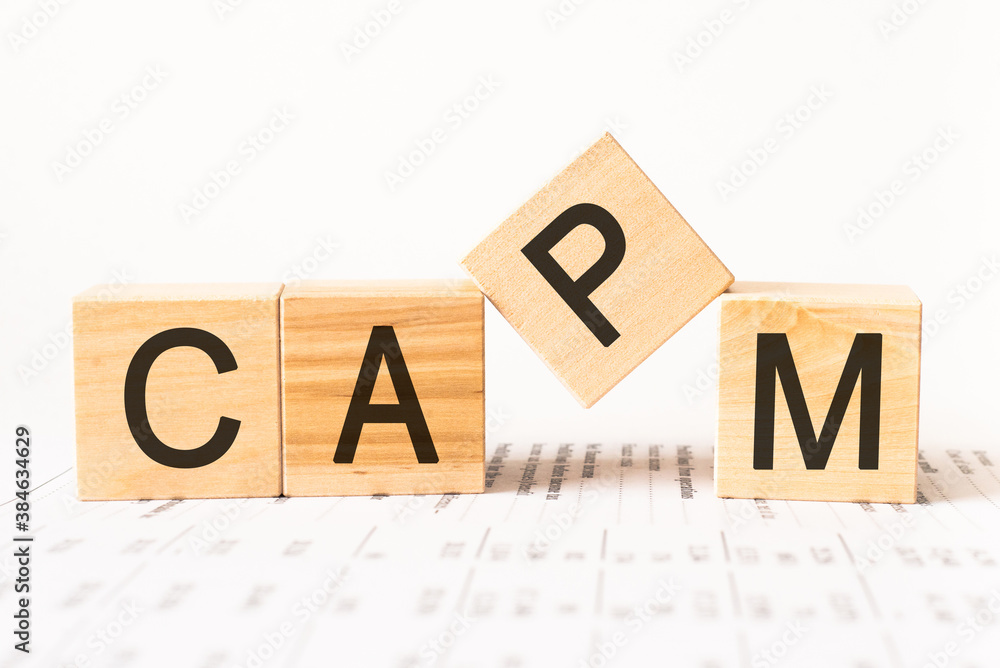 Word capm. Wooden small cubes with letters isolated on white background with copy space available.Business Concept image. Word capm. Wooden small cubes with letters isolated on white background with copy space available.Business Concept image.