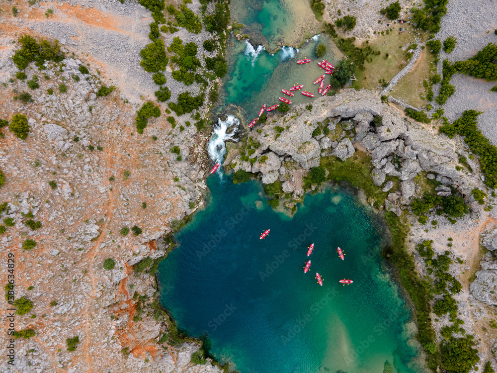 Zrmanja River in northern Dalmatia, Croatia is famous for its crystal clear waters and countless waterfalls surrounded by a deep canyon. Zrmanja River in northern Dalmatia, Croatia is famous for its crystal clear waters and countless waterfalls surrounded by a deep canyon.