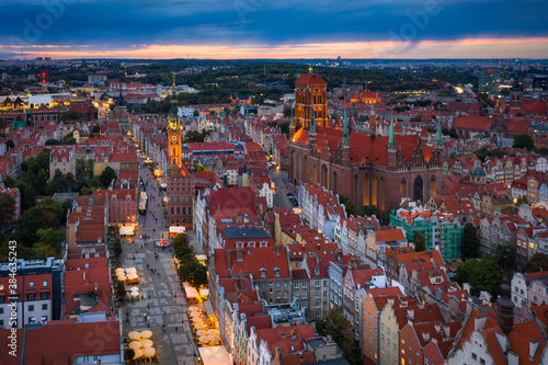 Beautiful sunset over the old town of Gdansk with City Hall and St. Mary Basilica, Poland