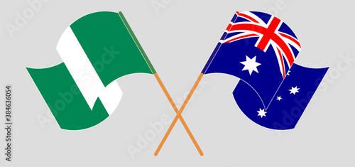 Crossed and waving flags of Nigeria and Australia