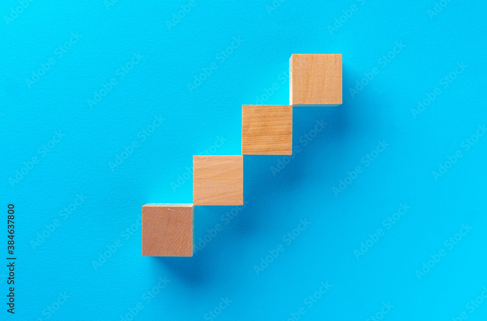 Top view of wooden toy blocks on blue Top view of wooden toy blocks on blue