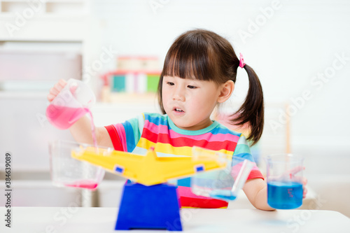 young girl play balance toy for homeschooling