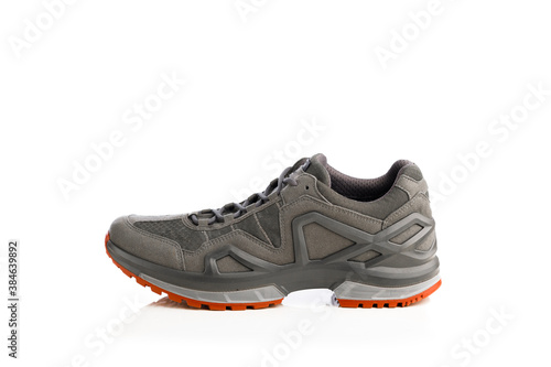 trekking sneaker with red sole, isolated on white