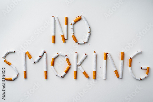 Inscription word NO SMOKING made out of cigarettes top view