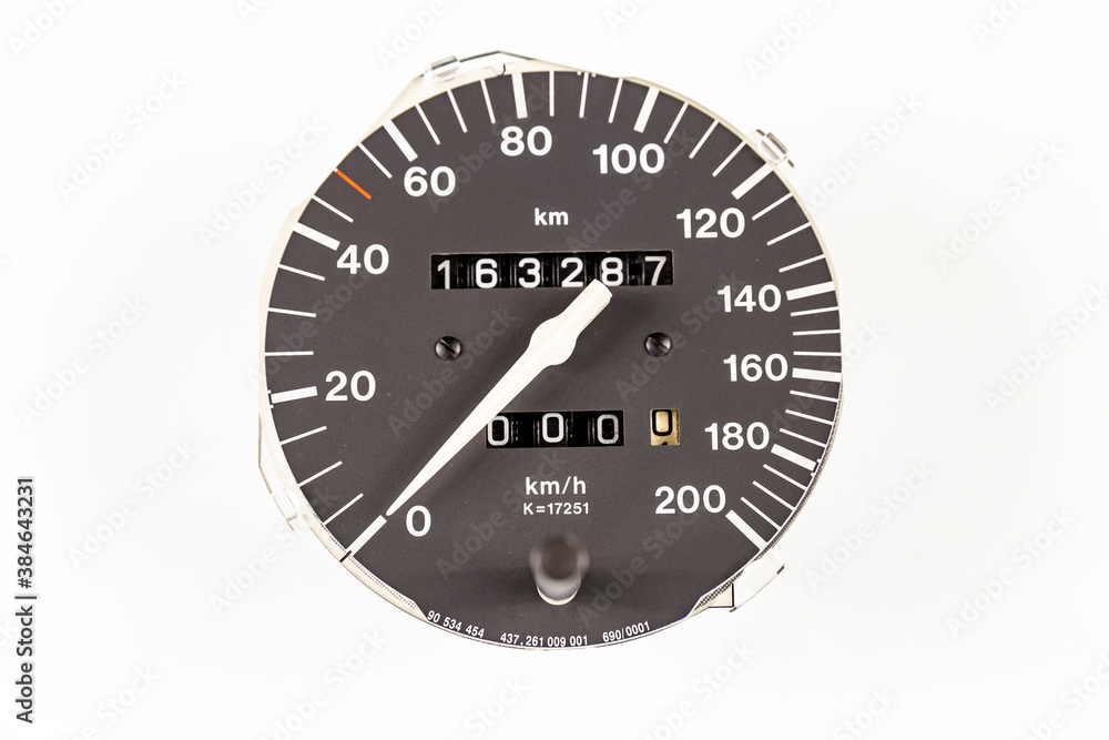 an analog car speedometer with built-in odometers isolated on a white background an analog car speedometer with built-in odometers isolated on a white background