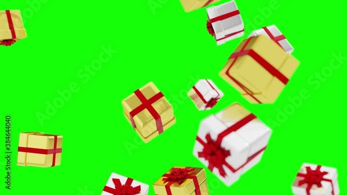 Gold and silver boxes with gifts are falling on a green background. Looped Seamless Video. Luma Matte Transition. Alpha Channel Mask. Soft focus.