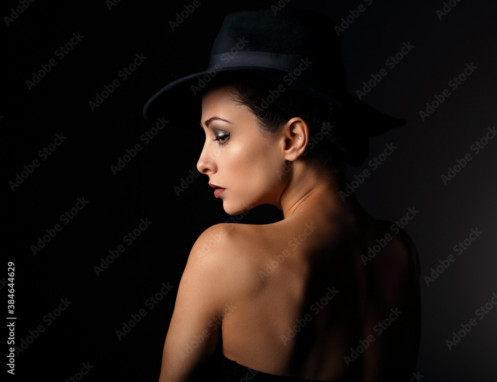 Beautiful makeup woman with elegant healthy neck, nude back and shoulder on black background in fashion hat with empty copy space. Closeup profile view portrait. Beautiful makeup woman with elegant healthy neck, nude back and shoulder on black background in fashion hat with empty copy space. Closeup profile view portrait.