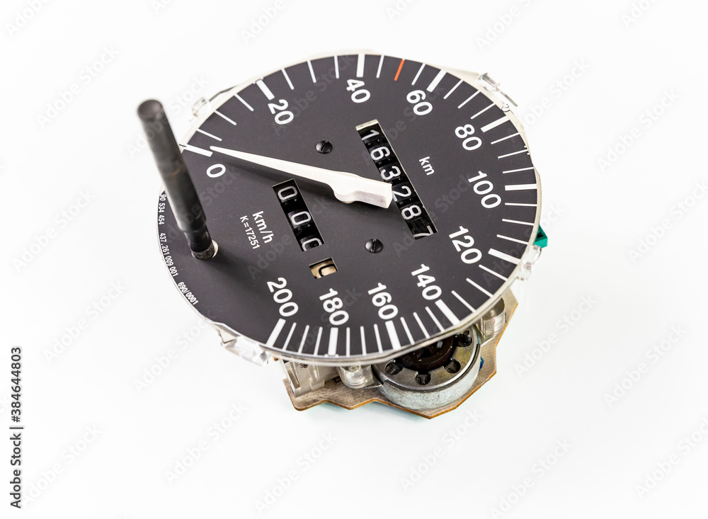 an analog car speedometer with built-in odometers isolated on a white background an analog car speedometer with built-in odometers isolated on a white background