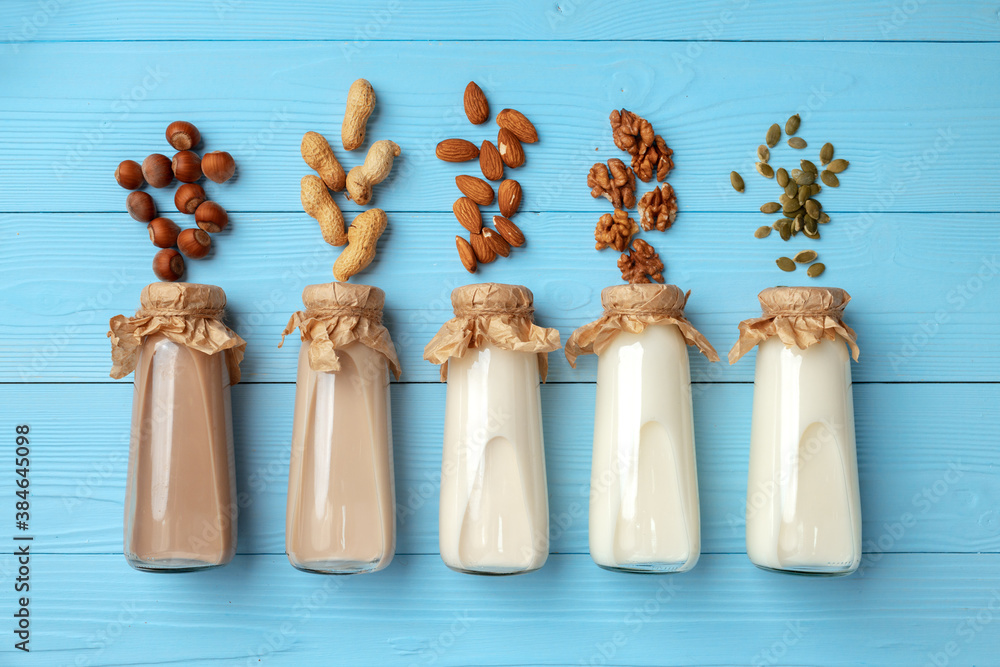 Concept of organic vegan non dairy milk with glass milk bottle and bulk products Concept of organic vegan non dairy milk with glass milk bottle and bulk products
