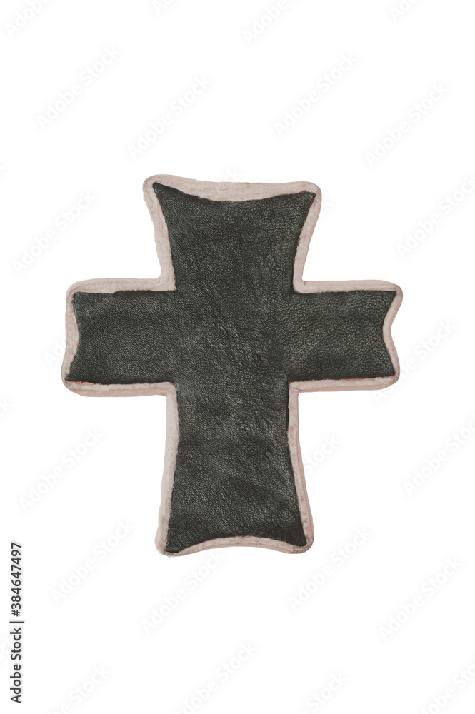 Fototapeta premium Black & white leather cross in simple design on an isolated background.. The cross is handmade in two tones of leather. It is a symbol for faith and Christianity.