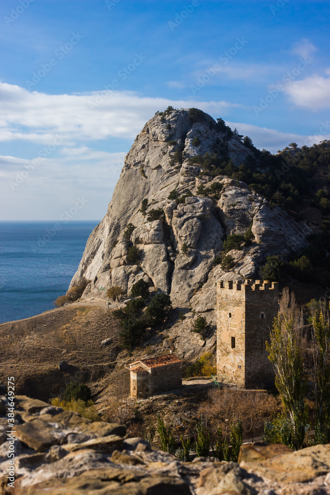 The tower of Frederico Astaguerro in the Genoese fortress and the temple of the Twelve Apostles in Sudak, Crimea.