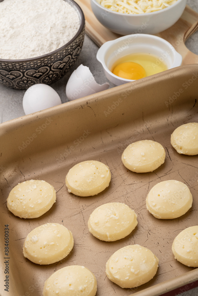 Uncooked typical brazilian cheese breads with ingredients