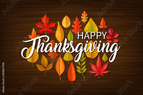 Happy Thanksgiving vector greeting card with typography and fallen leaves of maple, oak, birch or rowan and elm on wooden background. Thanks Giving day fall banner, autumn season holiday, tree foliage