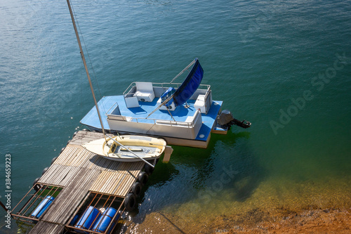 Boat parked the dock © alexander