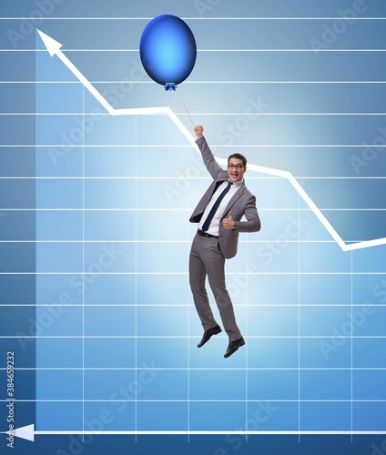 Businessman flying on hot balloon over graph © Elnur