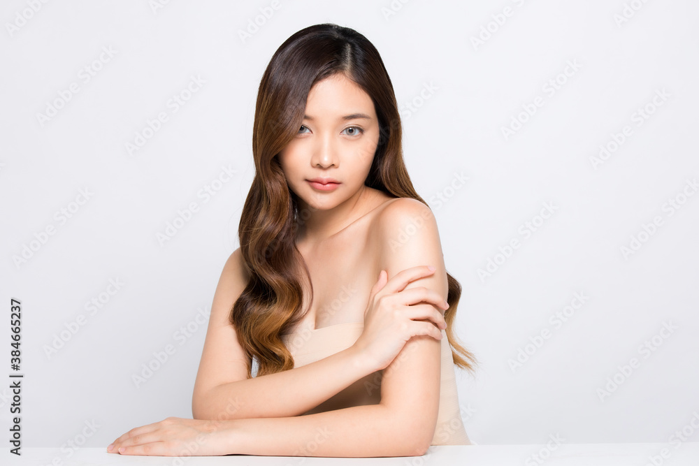 Portrait of beautiful young woman sitting isolated on white background Portrait of beautiful young woman sitting isolated on white background