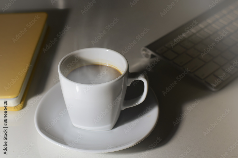 Hot cup of coffee on the desk Hot cup of coffee on the desk