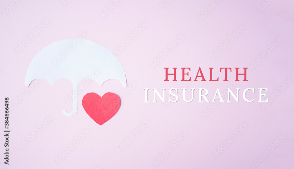 Red paper heart shape under white paper umbrella as life with words health insurance, health insurance concept. Assurance. insurance life symbol