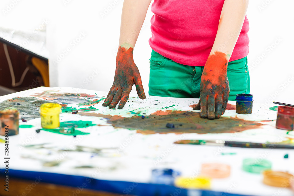 boy paint with hands drawing lesson at school boy paint with hands drawing lesson at school
