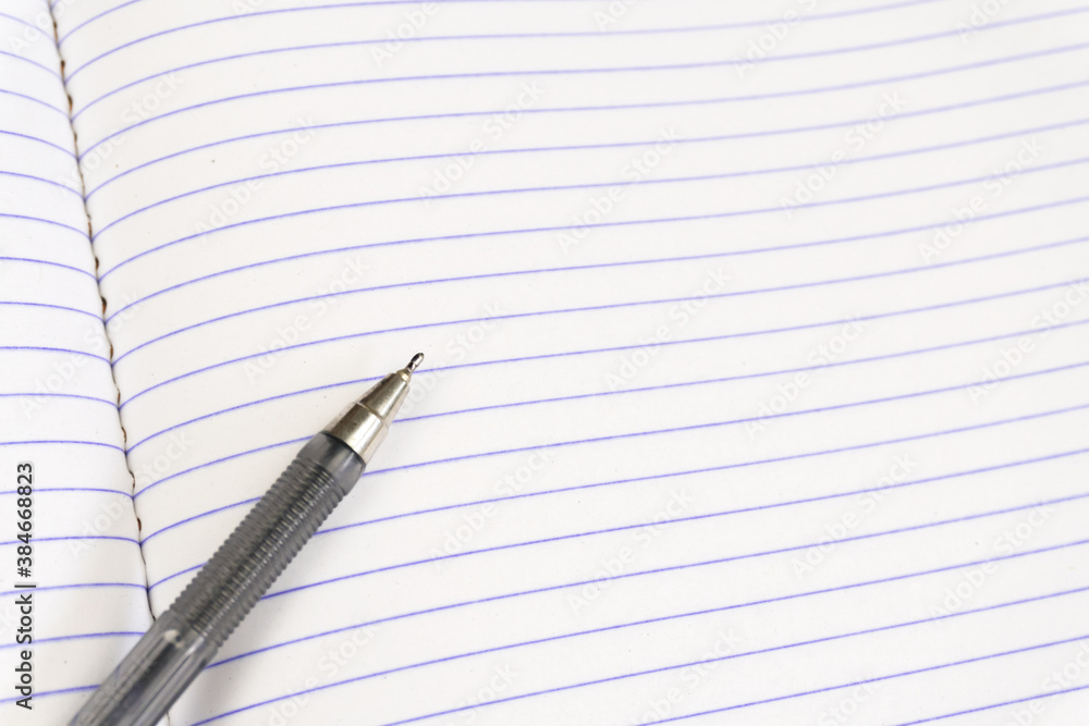 A set of office supplies. Blank notepad and pen close up. Copy space A set of office supplies. Blank notepad and pen close up. Copy space