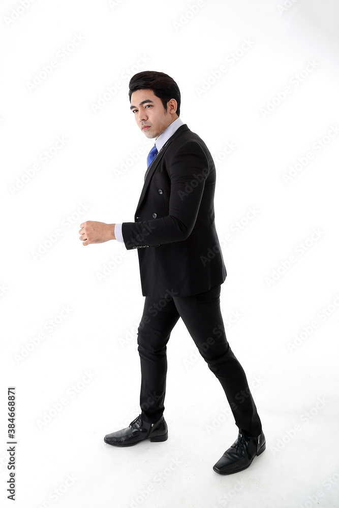Southeast Asian young office business man wearing suit turn back look at camera on white studio background Southeast Asian young office business man wearing suit turn back look at camera on white studio background
