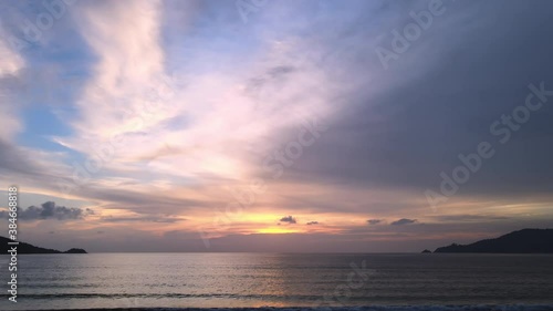 4K Phuket Thailand beautiful tropical beach with sunset sky. Beautiful Phuket beach is famous tourist destination at Andaman sea summer concept. New normal after covid-19