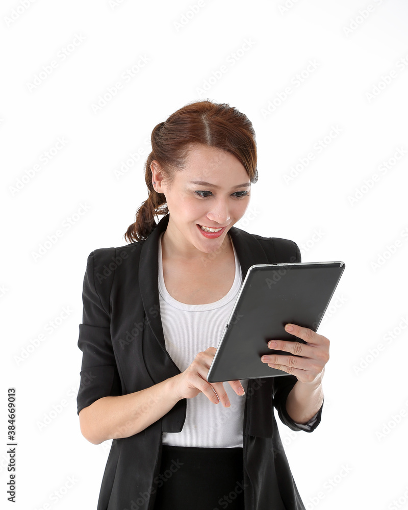 Southeast Asian young office business woman wearing suit holding reading using tablet tab on white studio background Southeast Asian young office business woman wearing suit holding reading using tablet tab on white studio background