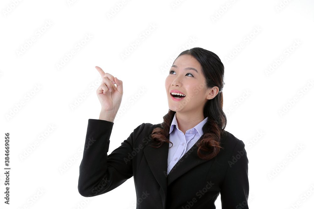 Southeast Asian young office business woman wearing suit point up happy smile expression on white studio background Southeast Asian young office business woman wearing suit point up happy smile expression on white studio background