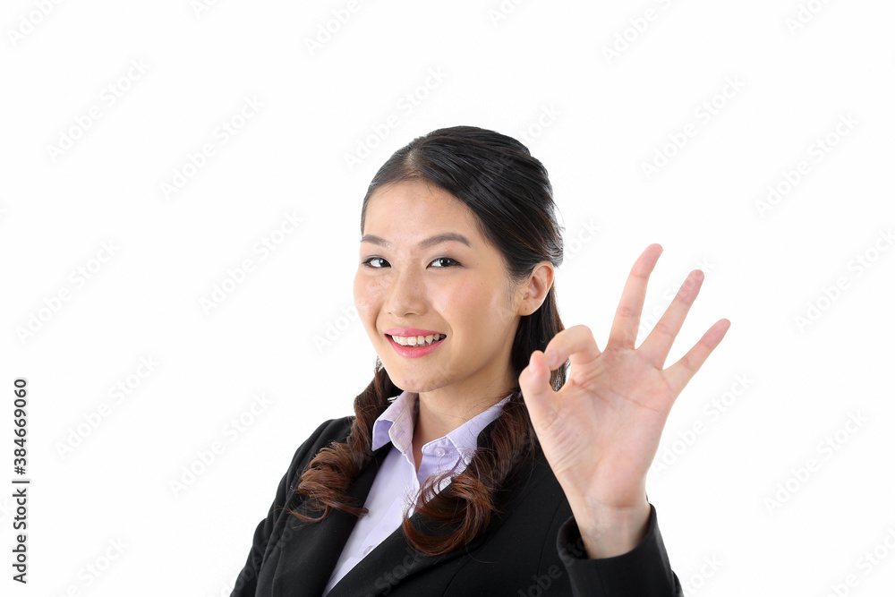 Southeast Asian young office business woman wearing suit ok finger sign smile expression look at camera on white studio background Southeast Asian young office business woman wearing suit ok finger sign smile expression look at camera on white studio background