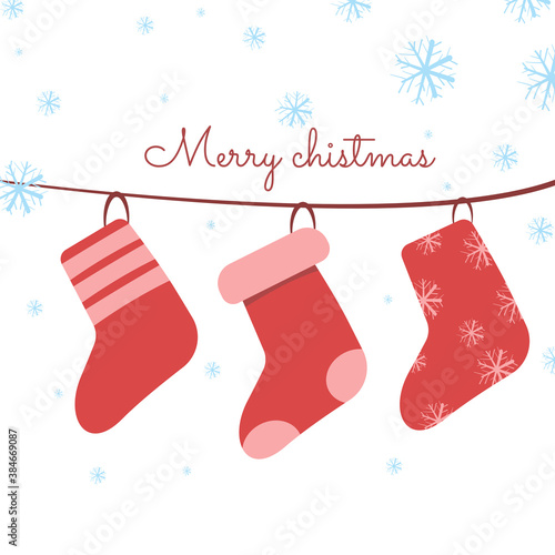 Christmas red socks hanging on the rail , Snow falling and Christmas greetings