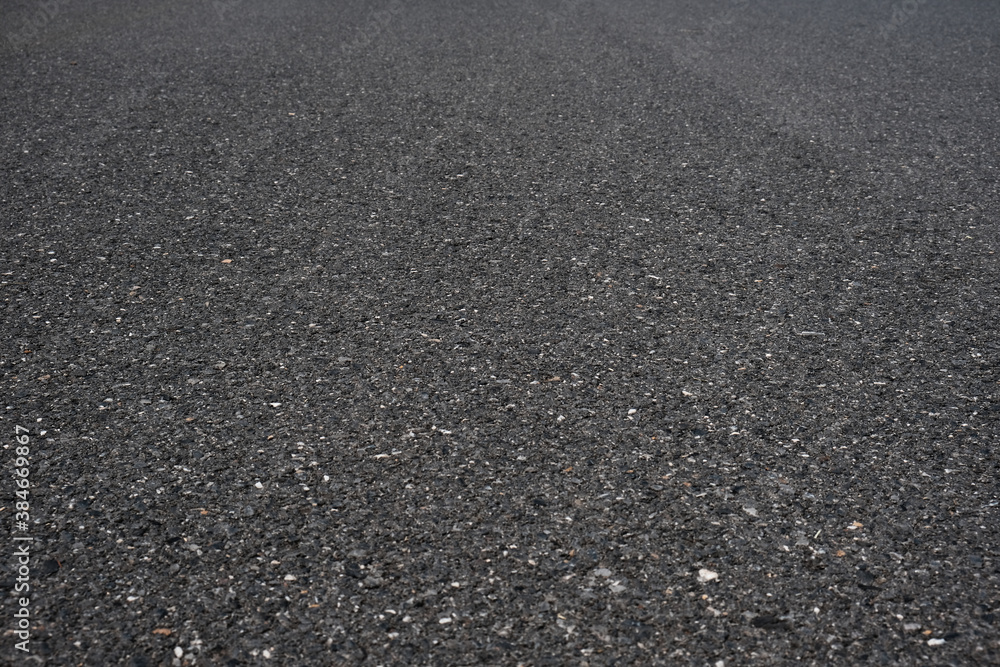 Asphalt road surface low angle background. Asphalt road surface low angle background.