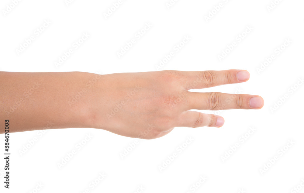 In front of white background, a hand stretches out fingers to make a three gesture In front of white background, a hand stretches out fingers to make a three gesture
