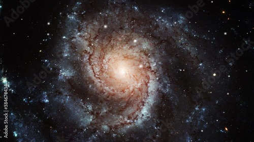 a spiral galaxy moving around in the universe photo